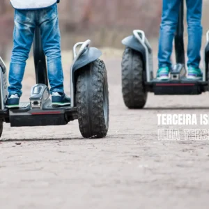 Two individuals riding Segways on a path, with focus on their legs and the Segway devices.