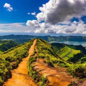 Path leading to a viewpoint overlooking Sete Cidades with lakes and hills in the background.